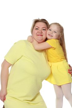 Young blonde mother, gently hugs her favorite little round-faced daughter. Family Idyll.Isolated on white background.