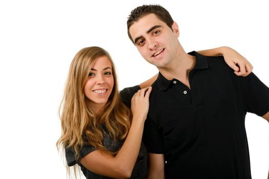 Portrait of a happy couple smiling at camera on black background