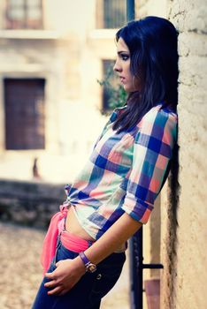 Portrait of a young beautiful woman in a urban background