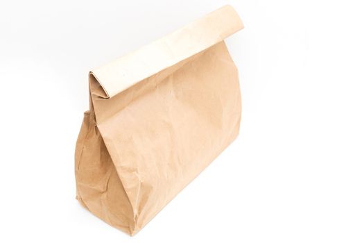 brown clear empty blank craft paper bag for takeaway isolated on white background. Packaging template mock up. Delivery service concept. Copy space.