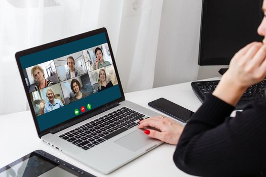 Virtual meeting online. Video conference by laptop. Online business meeting. On the laptop screen, people who gathered in a video conference to work on-line.