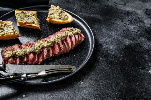 Grilled denver marble black angus beef steak. Black background. Top view. Copy space.