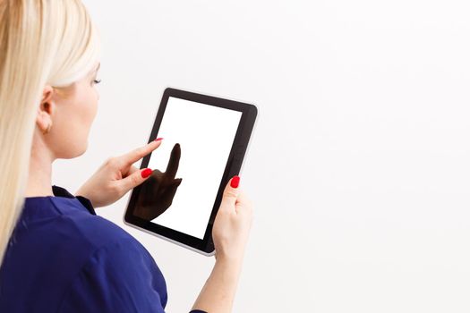 Business woman holding blank touch screen device.