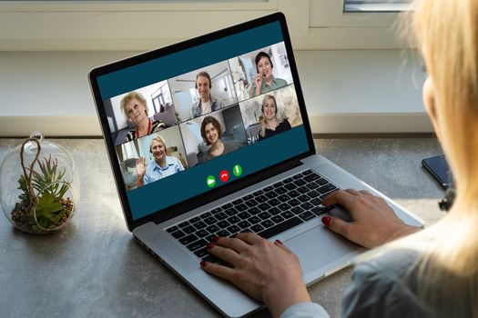 Virtual meeting online. Video conference by laptop. Online business meeting. On the laptop screen, people who gathered in a video conference to work on-line.