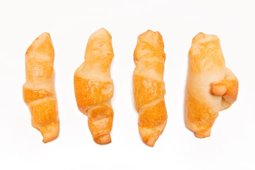 Fresh homemade cakes. Buns. Croissants isolated on white background.