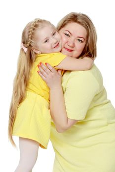 Young blonde mother, gently hugs her favorite little round-faced daughter. Family Idyll.Isolated on white background.