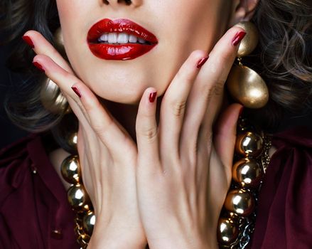 beauty rich woman with bright makeup wearing luxury jewellery on black background, fashion lady close up