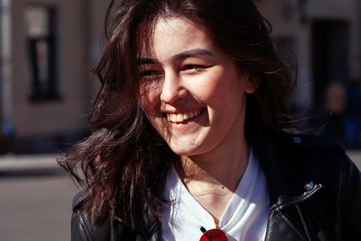 young pretty asian girl wearing sunglasses outside on big city street, lifestyle people concept close up