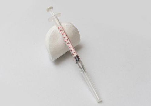 Medical treatment vaccine and syringe for injections on a white background. Prevention and treatment of coronary infection. Medicine is an infectious concept.