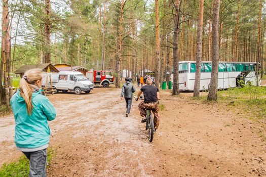Belarus, Minsk Region - June 29, 2019: Camp in the forest with tourists outdoor, travel and leisure, camping lifestyle.