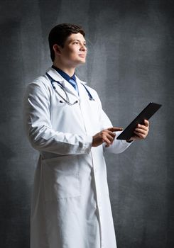 The doctor with the computer tablet. Digital technology in healthcare