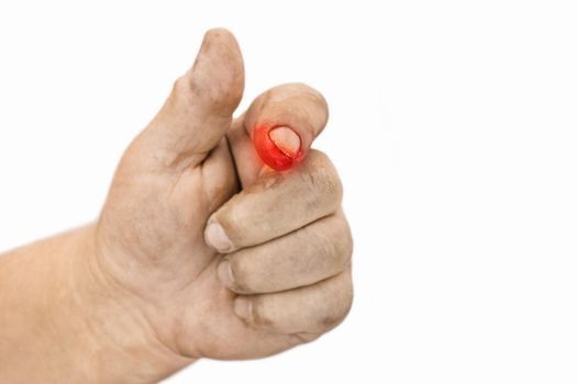 Selective focus on index finger of dirty working hand of man with bloody wound on white isolated background.