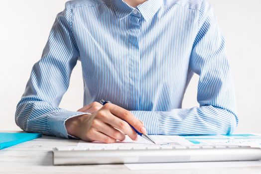 Business consultant sitting at desk and analyze financial report. Strategy planning and investment. Corporate office workplace with analyst at wooden desk. Business accounting and management.