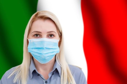 Woman in face mask against Italian flag. Concept of attention about spread of Chinese COVID-19 Novel Coronavirus Pneumonia virus around world