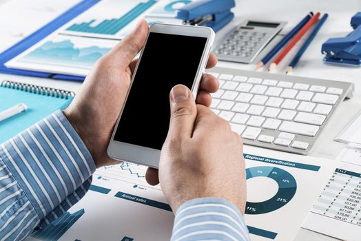 close-up of men's hands with a phone. Office work