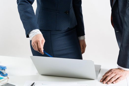 Corporate teamwork concept with business people. Office desk with financial charts. Business meeting time in conference hall. Presentation and discussion of new startup project. Business partnership