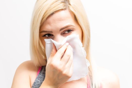 Woman has a cold on white background