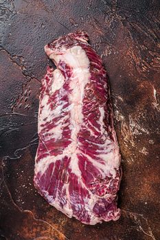 Raw hanging tender or onglet beef meat steak. Dark background. Top View.