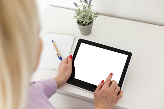 Business woman holding blank touch screen device.