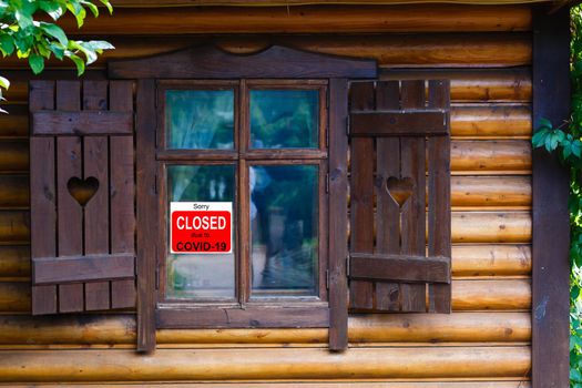 Business center closed due to COVID-19, sign with sorry in door window. Stores, restaurants, offices, other public places temporarily closed during coronavirus pandemic. Economy hit by corona virus.