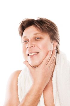 Man examining his stubble in mirror isolated over white