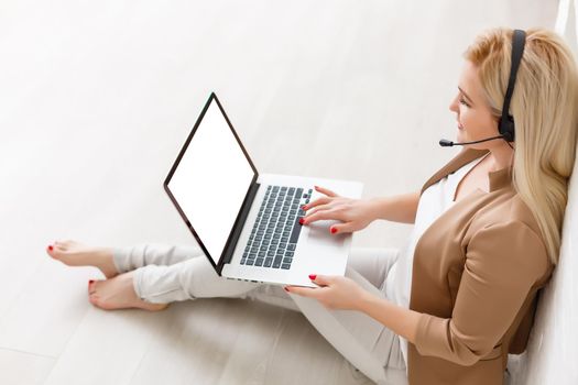 view of young successful female freelancer use laptop for distance work during her recreation time, woman's hands keyboarding on portable laptop computer with blank copy space on the screen