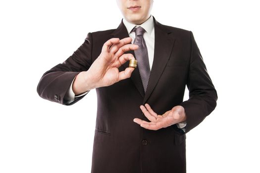 businessman holding coins in his hand isolated over white