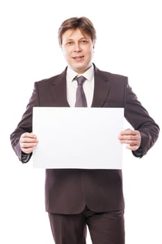 Businessman holding a white piece of paper with empty space for advertisement or information