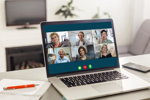 Virtual meeting online. Video conference by laptop. Online business meeting. On the laptop screen, people who gathered in a video conference to work on-line.