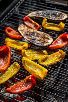 Grilled vegetables on barbecue, outdoor BBQ grill with fire. Top view.