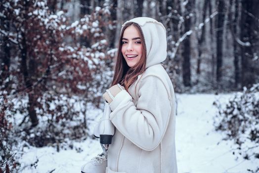 Winter woman. Winter portrait of young beautiful brunette woman in snow Garden. People in snow. Woman winter portrait