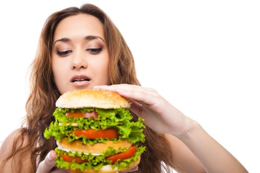 Happy Young Woman Eating big yummy Burger isolated on white background