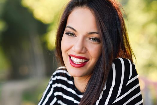 Portrait of pretty girl with green eyes wearing casual clothes, smiling