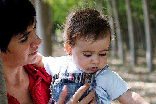 Mother and her little daughter enjoyoing a forest