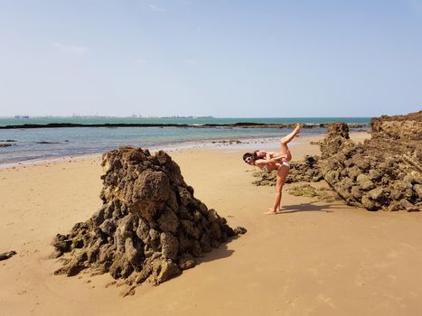 Mother and little daughter having fun on the beach of the Wall of Puerto Sherry, in Puerto de Santa Mar a, C diz, Andalusia, Spain.