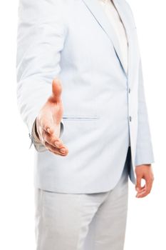 Close up of businessman wearing light suit extended his hand to handshake isolated on white background