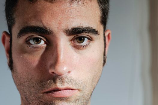 Closed portrait of a man with water drops