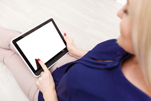 Business woman holding blank touch screen device.