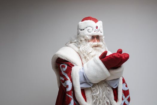 father frost with long beard waits of miracle, picture isolated on grey background