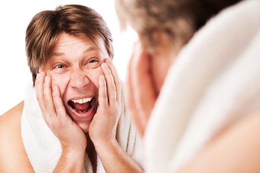 Screeming Man applying moisturizing lotion after shaving for his face