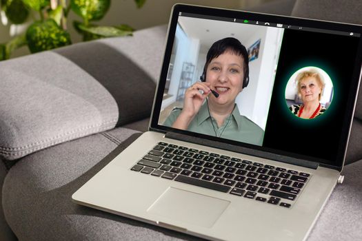 Virtual meeting online. Video conference by laptop. Online business meeting. On the laptop screen, people who gathered in a video conference to work on-line.