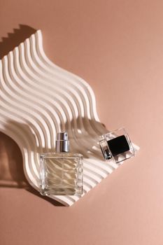 perfume bottle on the neutral modern background. perfect smell for him, man present