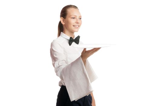 Portrait of smiling blonde waitress in uniform holding tray with towel