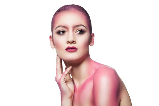 Portrait of young model in pink glitter looking away.Isolated