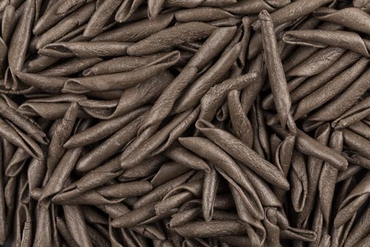 italian seppia pasta fusilli macaroni with cuttlefish ink, for background