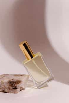 perfume bottle on the neutral modern background. perfect smell for him, man present