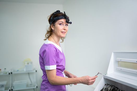 Professional otolaryngologist in modern clinic. Portrait of woman otolaryngologist or audiologist. Healthcare occupations. ENT doctor. Otolaryngology specialist posing in clinic.