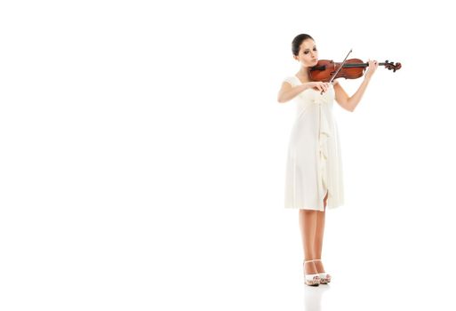 Beautiful young woman playing violin over white background