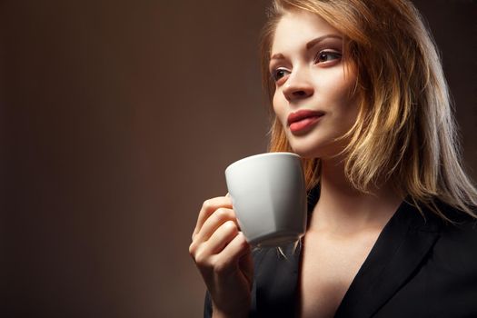 Coffee. Beautiful Girl Drinking Tea or Coffee. Cup of Hot Beverage