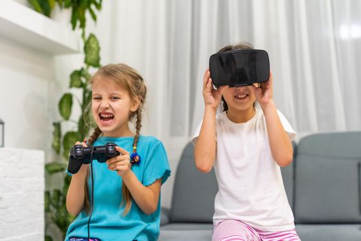 two little girls using glasses of virtual reality headset. concept of modern technologies